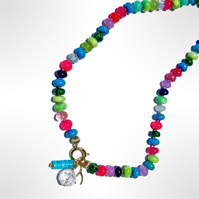 Pool Party statement necklace featuring hand-knotted multi-stone beads in blues greens pinks with gold clasp and turquoise charm detail