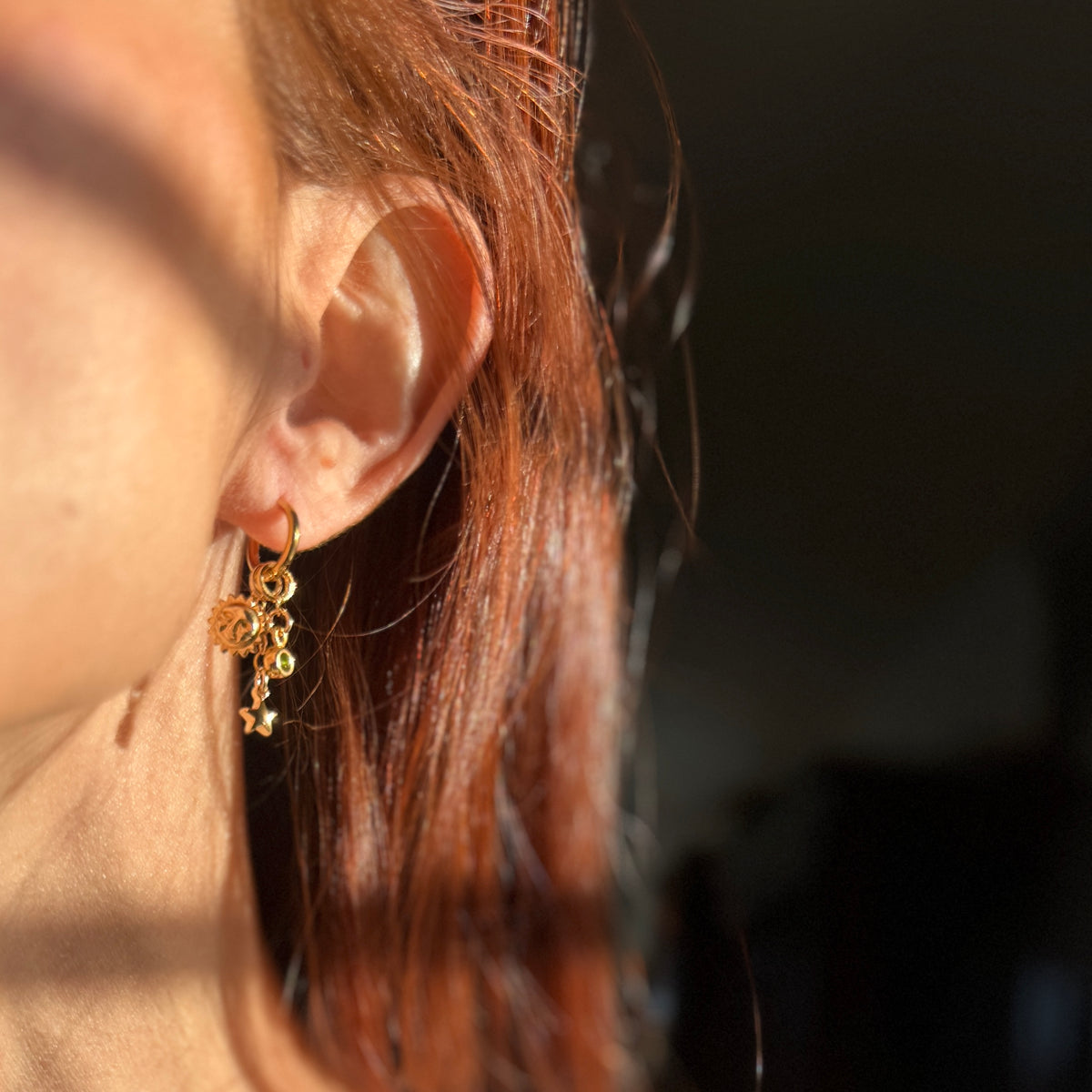 Gold filled mismatched charm earrings with lightning bolt and star